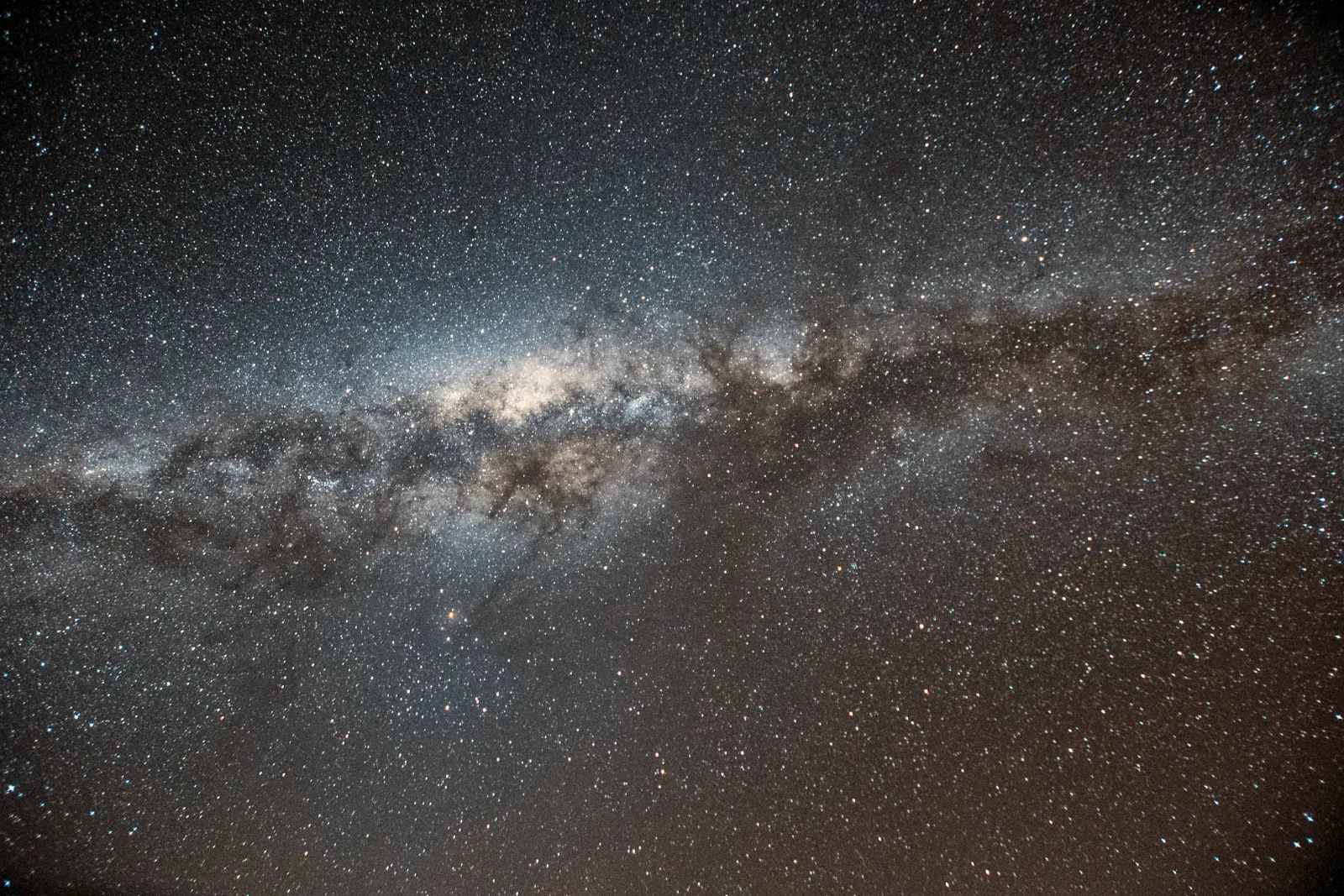 Close view of the Milky Way core, packed with stars and dark dust lanes, over the Atacama Desert